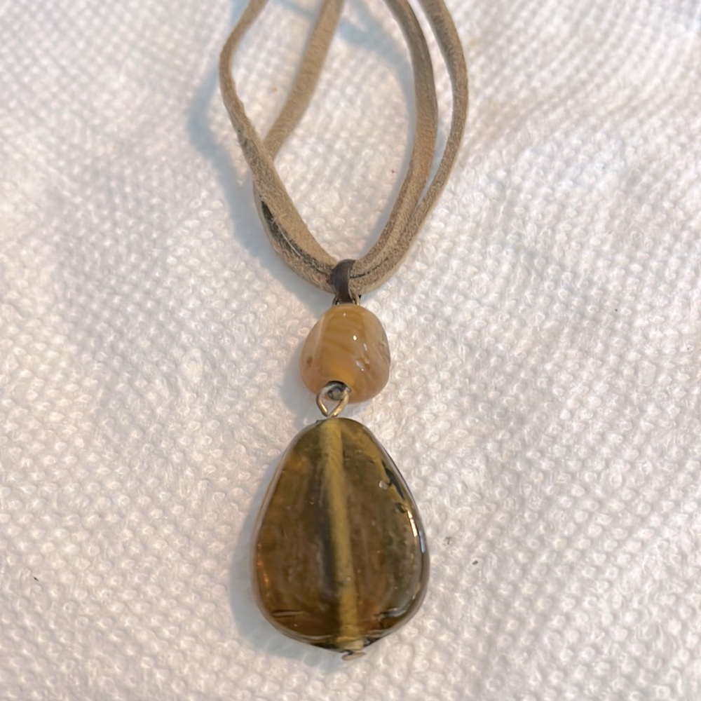 Brown stone pendant with brown leather chain